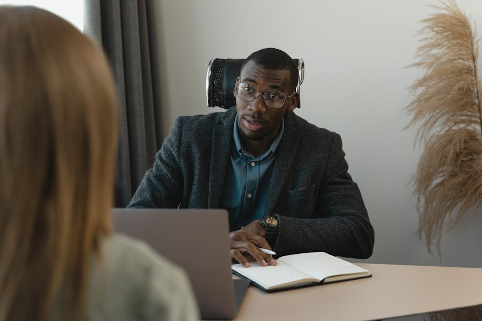 Businessman conducting a formal interview in a modern office environment