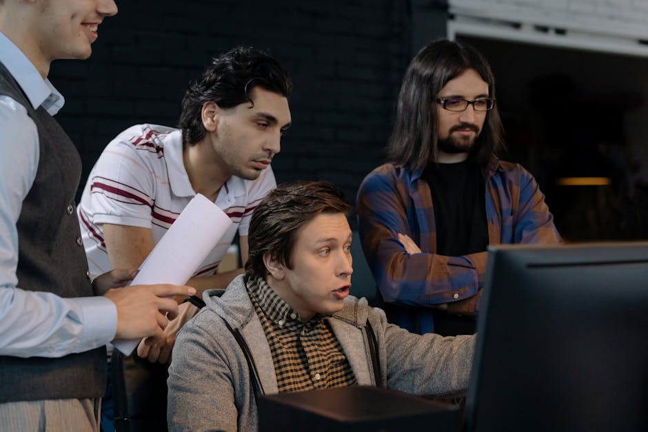 A diverse group of adults working together in a modern office environment.